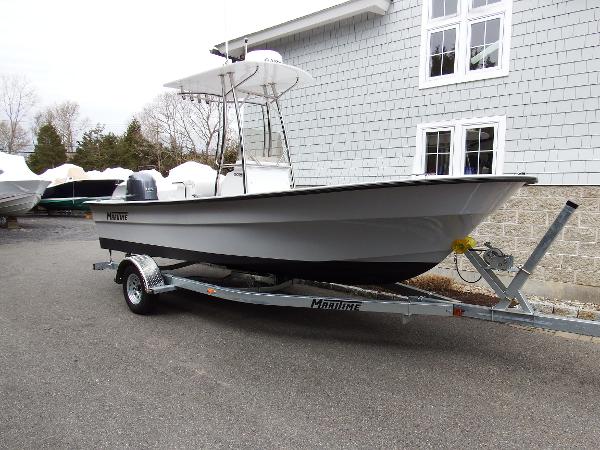 Slide: The Image of 2024 Maritime 2090 Skiff boat on trailer outside a building. - 20