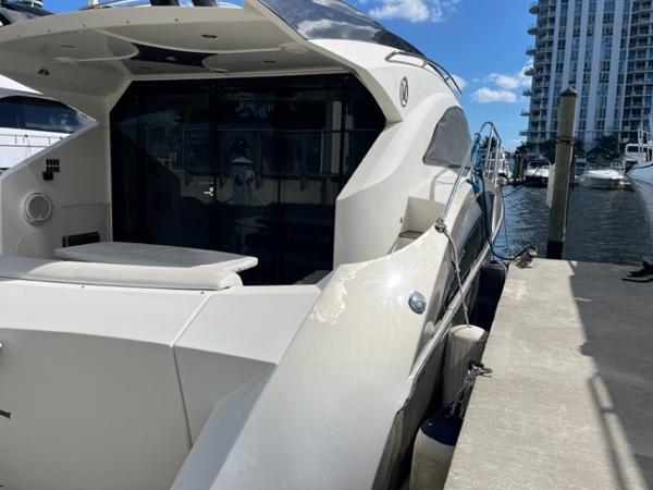 Slide: The Image of 2008 Marquis 40 SC yacht docked at marina on a sunny day. - 12