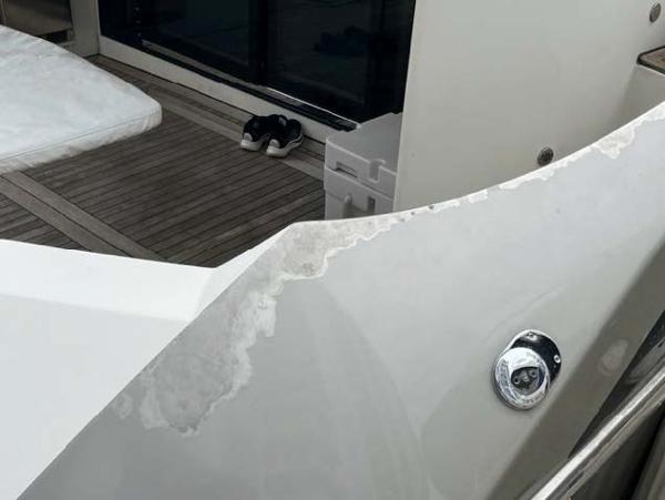Slide: The Image of 2008 Marquis 40 SC yacht deck with weathered paint and wooden flooring. - 26