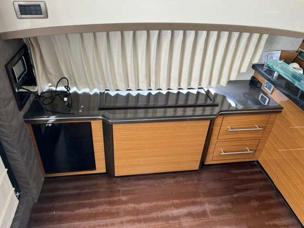 Slide: The Image of 2008 Marquis 40 SC yacht interior kitchen with modern cabinetry and appliances. - 36