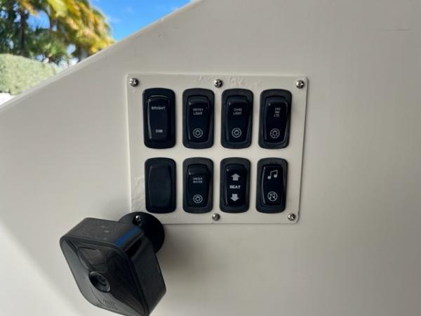 Slide: The Image of Control panel of a 2008 Marquis 40 SC yacht with various switches. - 7