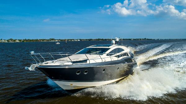Slide: The Image of 2009 Marquis 500 Sport Coupe yacht cruising on open water. - 0