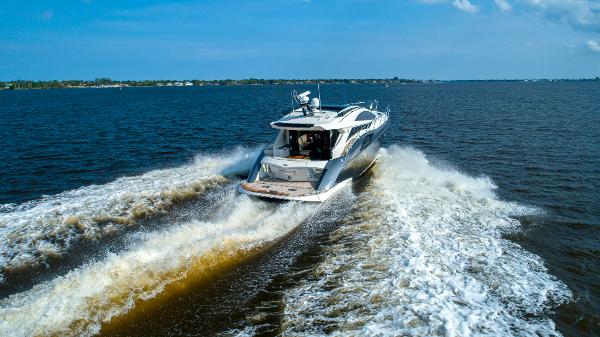 Slide: The Image of 2009 Marquis 500 Sport Coupe yacht cruising on open water. - 10