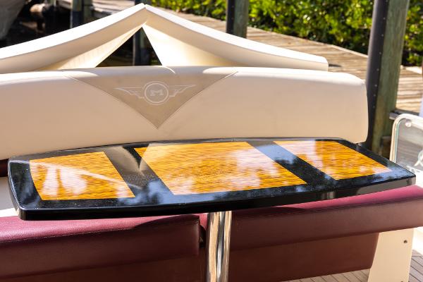 Slide: The Image of 2009 Marquis 500 Sport Coupe boat interior with a stylish wooden table. - 18