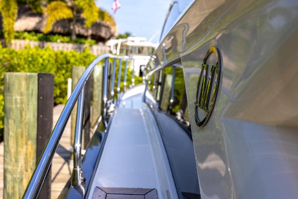 Slide: The Image of 2009 Marquis 500 Sport Coupe yacht docked at a marina. - 22