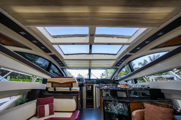Slide: The Image of Interior of 2009 Marquis 500 Sport Coupe yacht with panoramic windows and luxurious seating. - 25