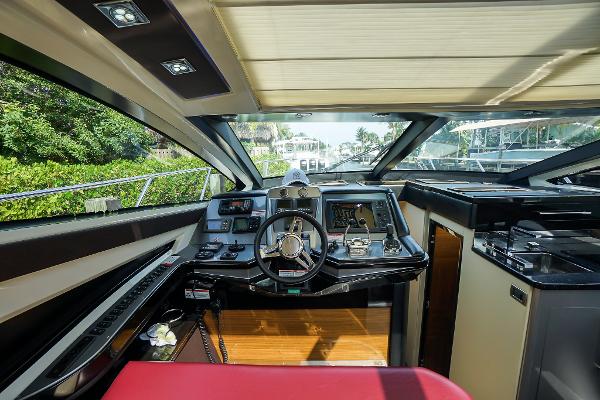Slide: The Image of Interior helm of 2009 Marquis 500 Sport Coupe yacht with modern controls and panoramic windows. - 33