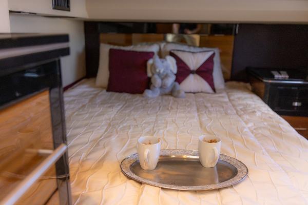 Slide: The Image of Luxurious bed in 2009 Marquis 500 Sport Coupe with coffee tray and plush toy. - 38