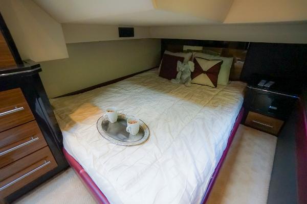 Slide: The Image of Luxurious bedroom in 2009 Marquis 500 Sport Coupe yacht with cozy bedding and coffee tray. - 43