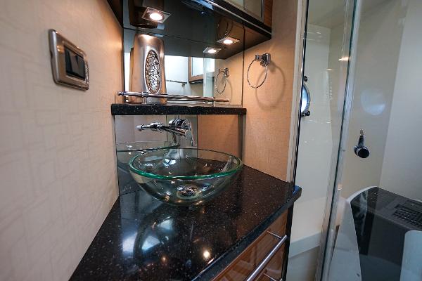 Slide: The Image of Luxurious bathroom in 2009 Marquis 500 Sport Coupe yacht with glass sink and modern fixtures. - 47