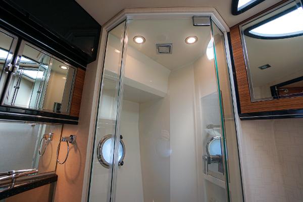 Slide: The Image of Luxurious bathroom in 2009 Marquis 500 Sport Coupe yacht with glass shower enclosure. - 48