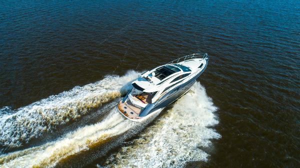 Slide: The Image of Aerial view of a 2009 Marquis 500 Sport Coupe yacht cruising on open water. - 9