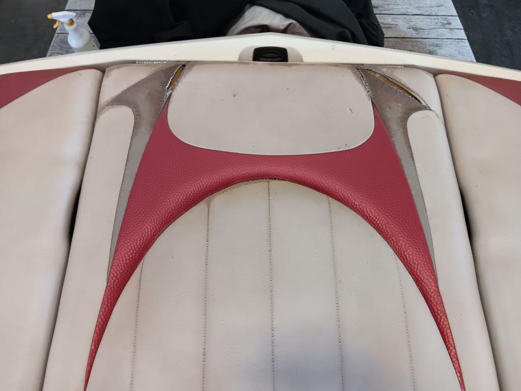 Slide: The Image of 2007 MasterCraft X15 boat interior upholstery with red and beige design. - 11
