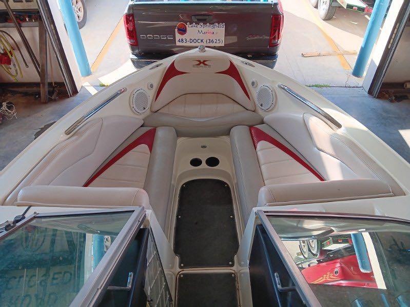 Slide: The Image of 2007 MasterCraft X15 boat interior with red and white seating. - 12
