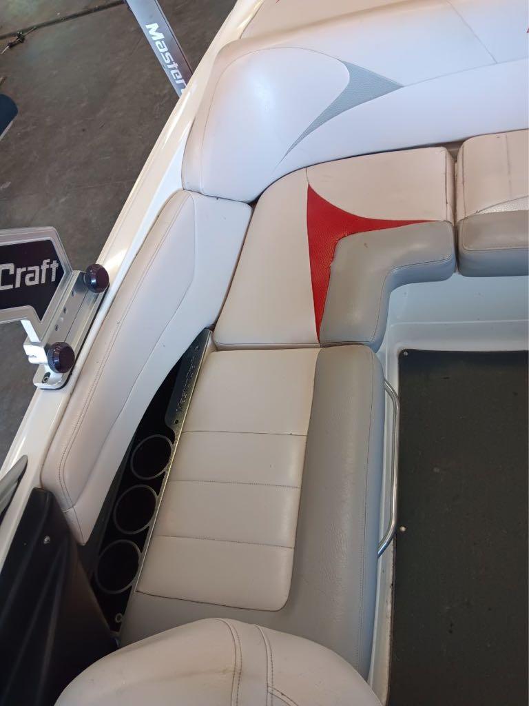 Slide: The Image of 2007 MasterCraft X15 boat interior seating with white and red upholstery. - 14