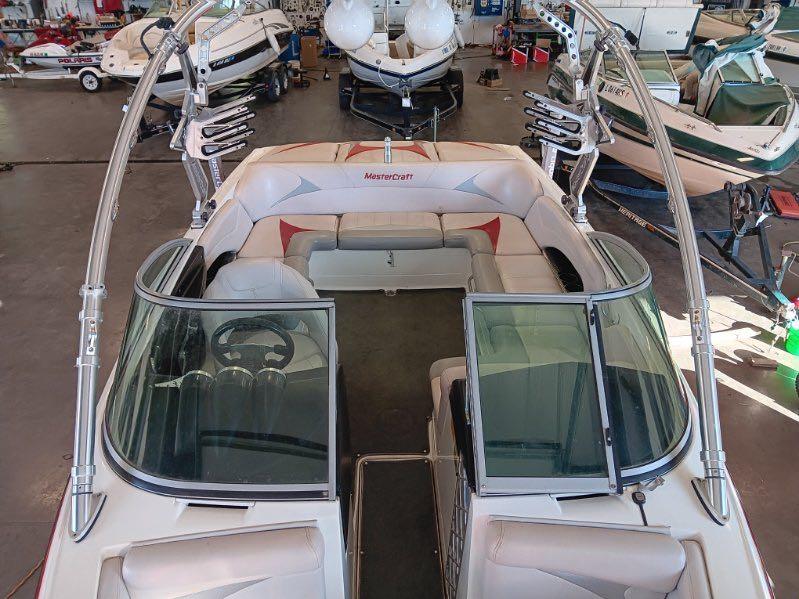 Slide: The Image of 2007 MasterCraft X15 boat interior in a showroom with other boats. - 17