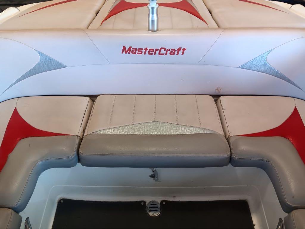 Slide: The Image of 2007 MasterCraft X15 boat interior with red and gray seating. - 3