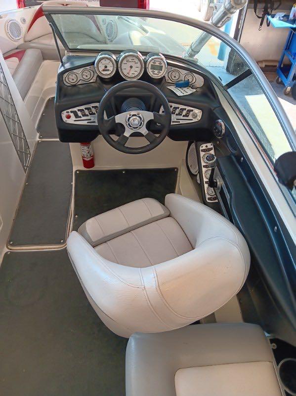 Slide: The Image of 2007 MasterCraft X15 boat cockpit with steering wheel and dashboard controls. - 4