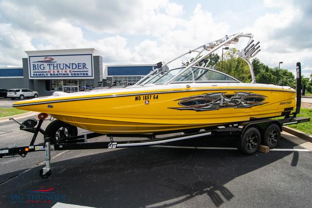 Slide: The Image of 2005 MasterCraft X45 yellow boat on trailer at Big Thunder Marine. - 1