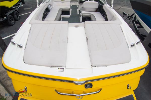 Slide: The Image of 2005 MasterCraft X45 boat with yellow exterior and spacious seating. - 12