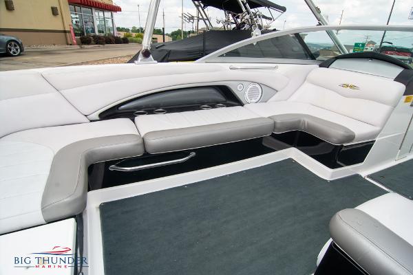 Slide: The Image of 2005 MasterCraft X45 boat interior with white and gray seating, Big Thunder Marine. - 16