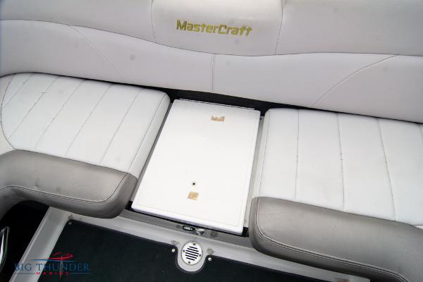 Slide: The Image of 2005 MasterCraft X45 boat interior seating with storage compartment. - 20
