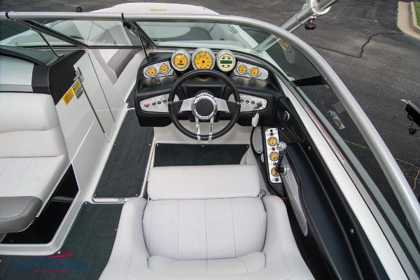 Slide: The Image of 2005 MasterCraft X45 boat cockpit with steering wheel and dashboard controls. - 22