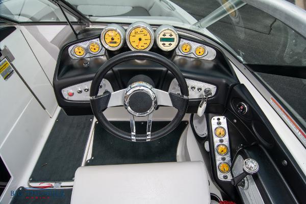 Slide: The Image of 2005 MasterCraft X45 boat dashboard with steering wheel and gauges. - 23