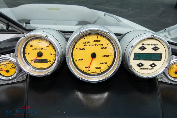 Slide: The Image of 2005 MasterCraft X45 boat dashboard with speedometer and gauges. - 24