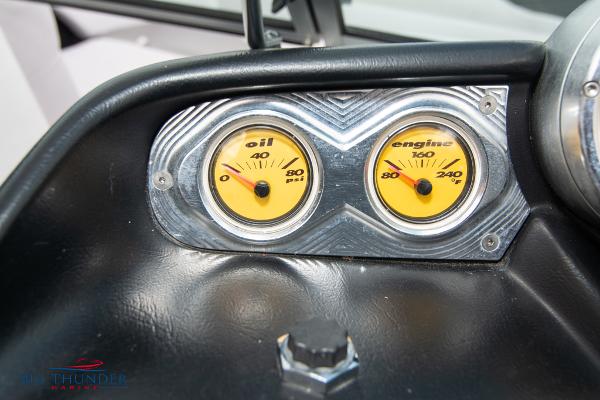 Slide: The Image of 2005 MasterCraft X45 boat dashboard with oil and engine gauges. - 26