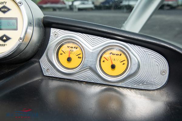 Slide: The Image of 2005 MasterCraft X45 dashboard with volt and fuel gauges. - 27