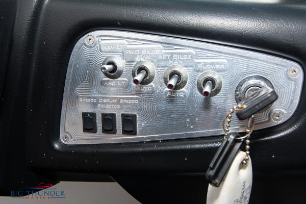 Slide: The Image of 2005 MasterCraft X45 boat control panel with switches and key. - 29