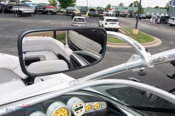 Slide: The Image of 2005 MasterCraft X45 boat interior with rearview mirror and dashboard gauges. - 34