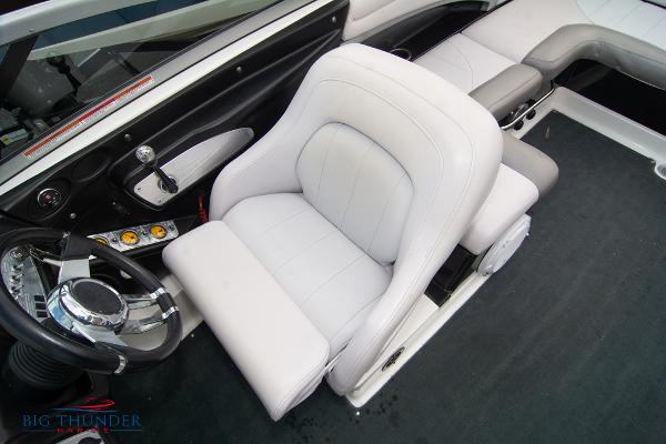 Slide: The Image of 2005 MasterCraft X45 boat interior with white captain's chair and steering wheel. - 36