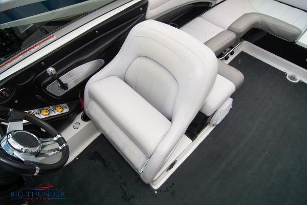 Slide: The Image of 2005 MasterCraft X45 boat interior with white captain's chair and steering wheel. - 37