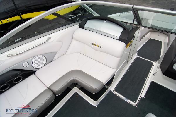Slide: The Image of 2005 MasterCraft X45 boat interior with white and gray seating, Big Thunder Marine logo. - 39