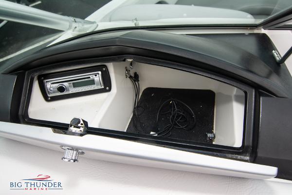 Slide: The Image of 2005 MasterCraft X45 boat dashboard storage compartment with stereo system. - 40