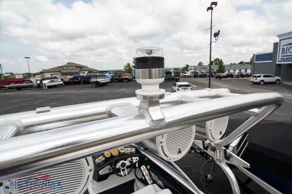 Slide: The Image of 2005 MasterCraft X45 boat dashboard and tower with speakers in a dealership lot. - 49