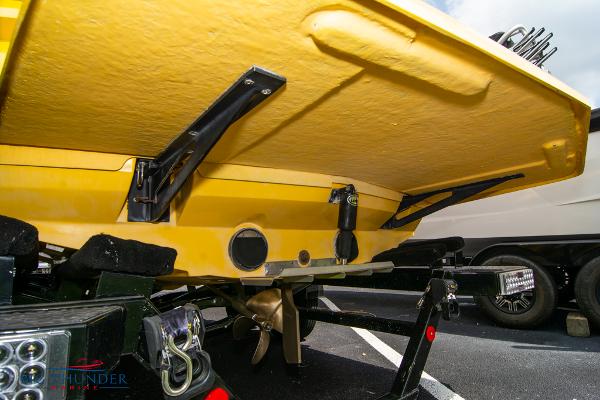 Slide: The Image of 2005 MasterCraft X45 boat stern view with propeller and trailer. - 8