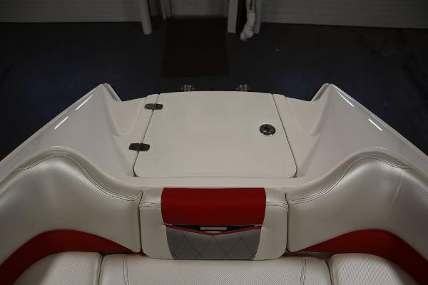 Slide: The Image of 2013 MasterCraft X55 boat interior with white and red upholstery. - 11