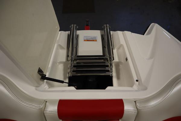 Slide: The Image of 2013 MasterCraft X55 boat with retractable ladder in storage compartment. - 13
