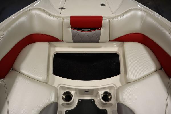 Slide: The Image of 2013 MasterCraft X55 boat interior with white and red seating. - 18