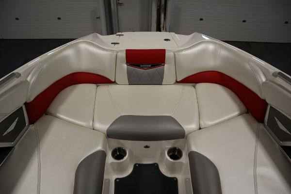 Slide: The Image of 2013 MasterCraft X55 boat interior with white and red cushioned seating. - 20
