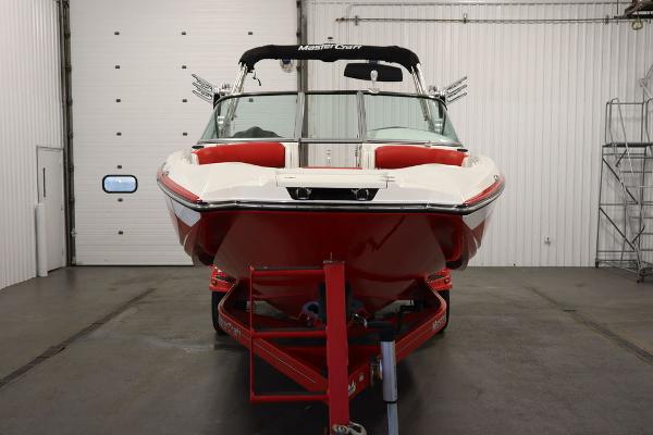 Slide: The Image of 2013 MasterCraft X55 boat in a garage, front view. - 3