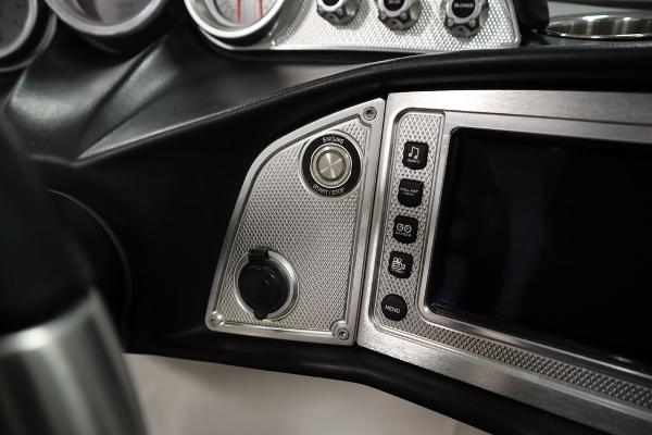 Slide: The Image of 2013 MasterCraft X55 boat dashboard with control panel and display screen. - 34