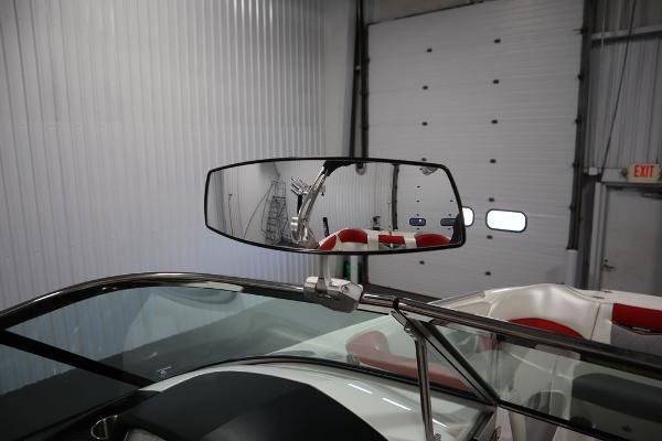 Slide: The Image of 2013 MasterCraft X55 boat interior with rearview mirror in a garage. - 47