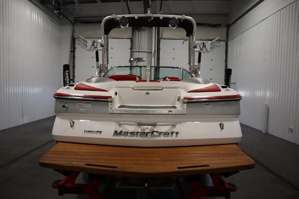 Slide: The Image of 2013 MasterCraft X55 boat in a storage facility, rear view. - 8