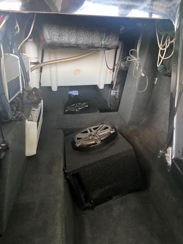 Slide: The Image of Interior of a 2013 MasterCraft XStar boat showing audio system components. - 11
