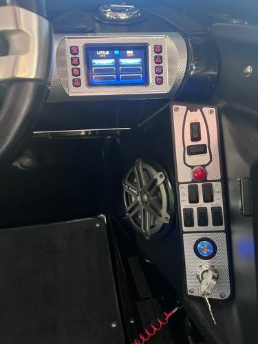Slide: The Image of 2013 MasterCraft XStar boat dashboard with touchscreen controls and speaker. - 15