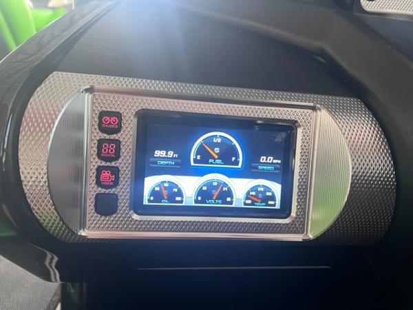 Slide: The Image of 2013 MasterCraft XStar dashboard with digital display showing depth, fuel, and voltage gauges. - 20